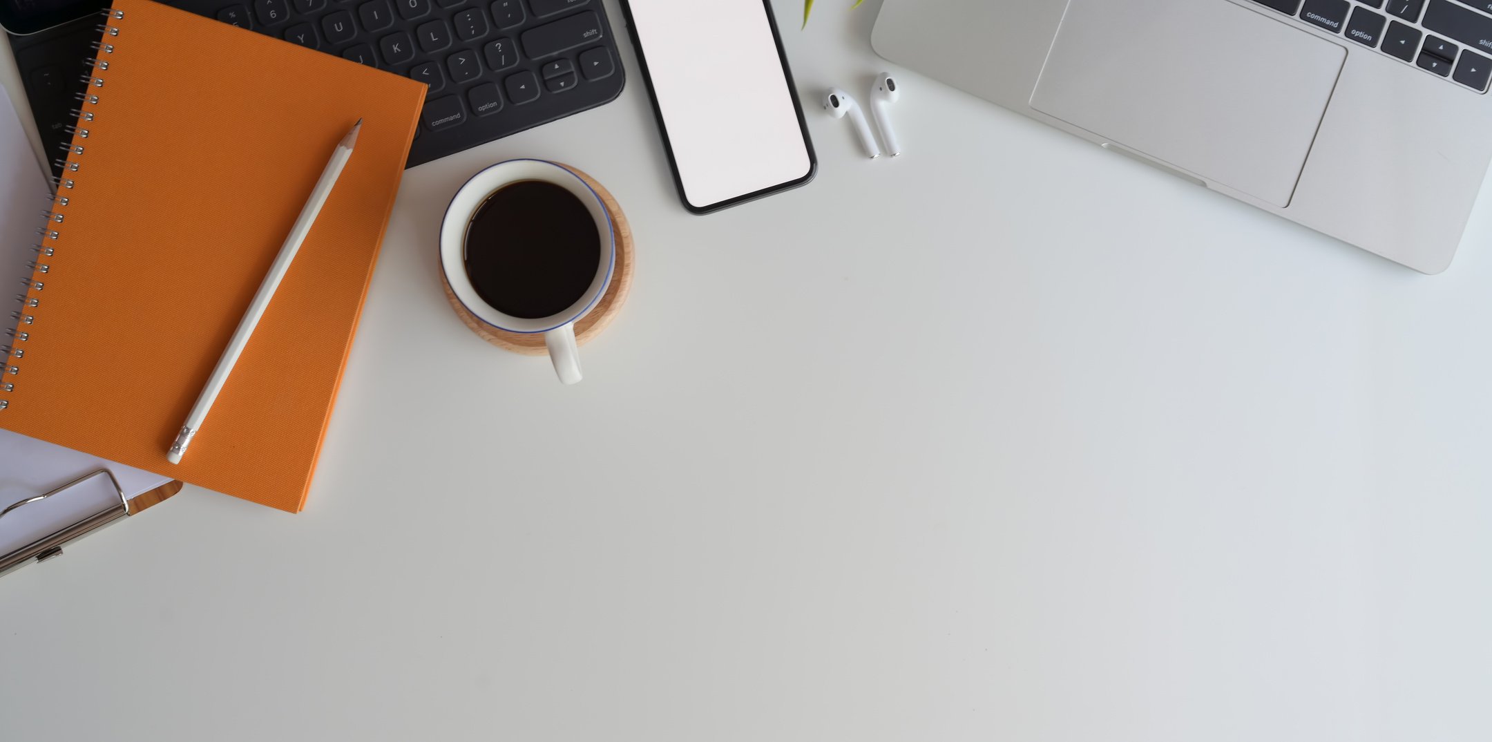 Freelance workspace with gadgets and coffee